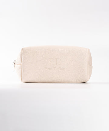 Pem Delian beige neszesszer fehér háttérrel